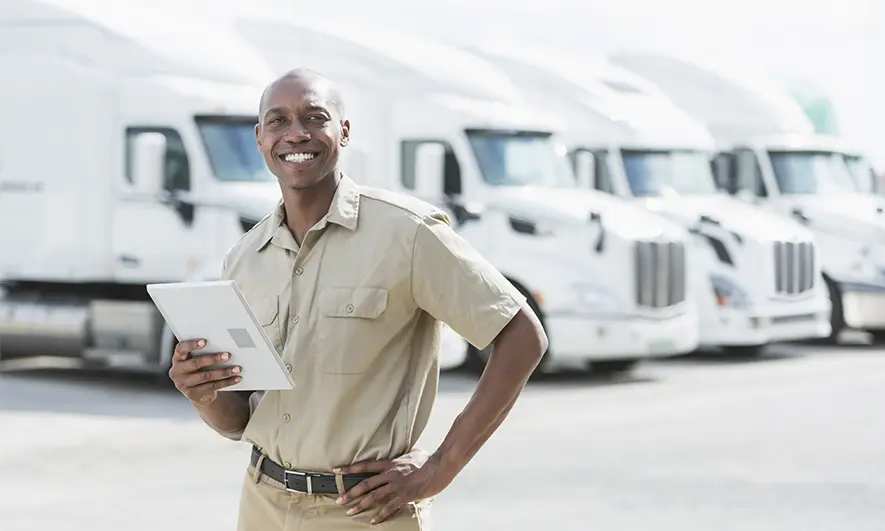 business owner happy to do his job after getting freight broker insurance coverage