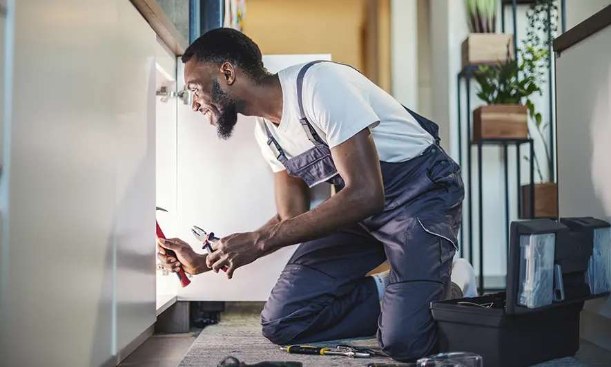 small business owner happy to do his job after getting handyman business insurance