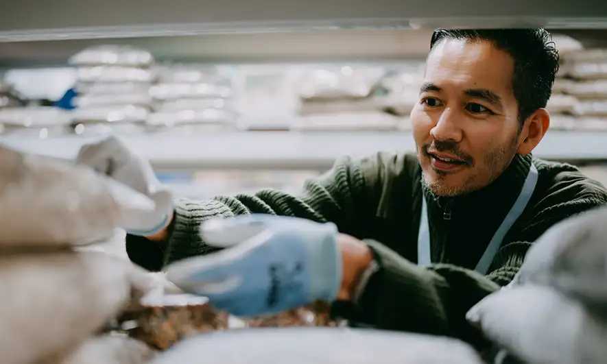 small business owner happy with his hardware store insurance quote from The Hartford