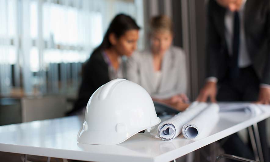 Architects and Engineers looking at blueprints