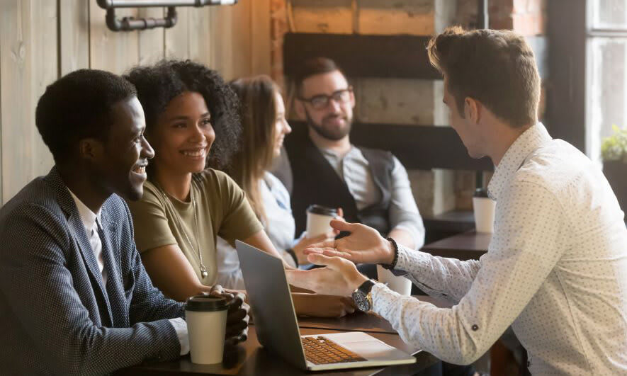Three people meeting in a coffee shop