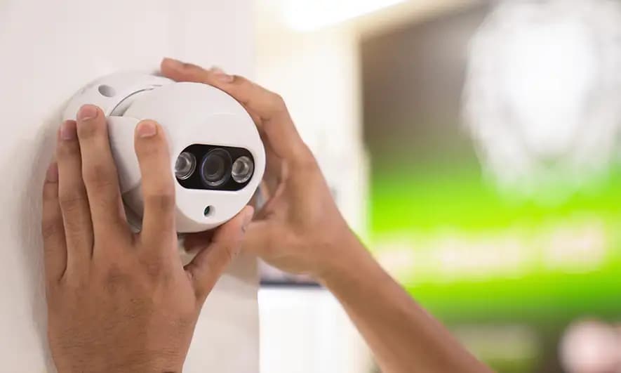 homeowner happy with home insurance discount for security system