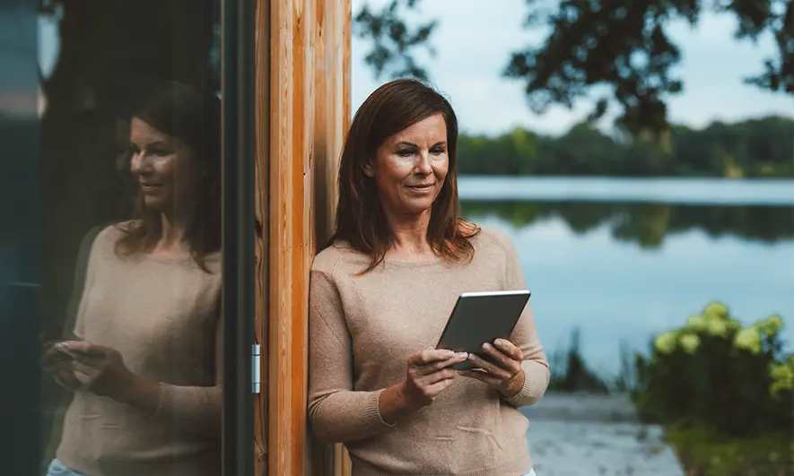 female homeowner protected by home insurance for second home