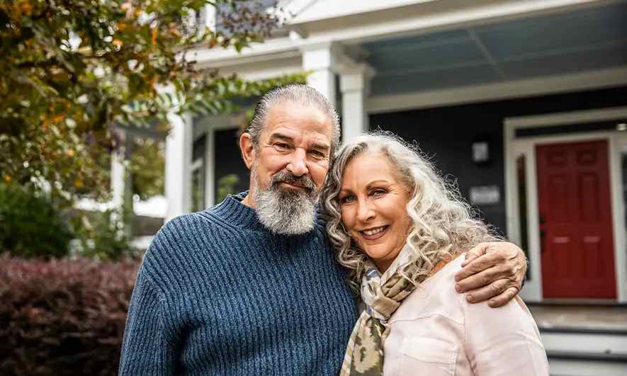 couple happy knowing the difference between homeowners insurance vs home warranty