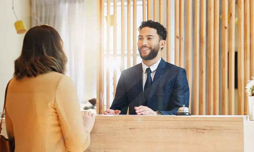 business owner happy to do his job after getting a hospitality and leisure insurance quote