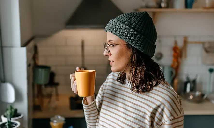 business owner happy to do her job after getting house sitters insurance