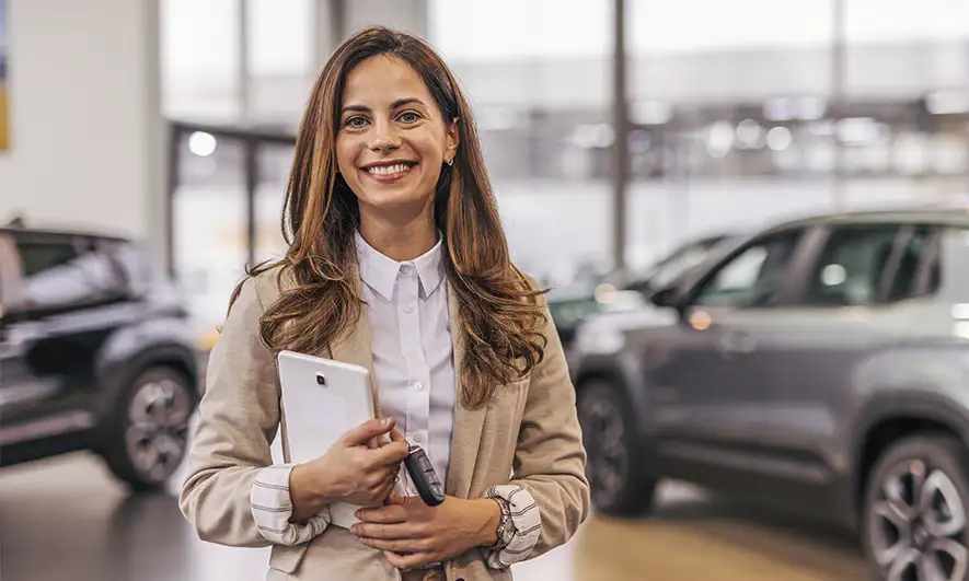 new female car owner happy knowing how car insurance works