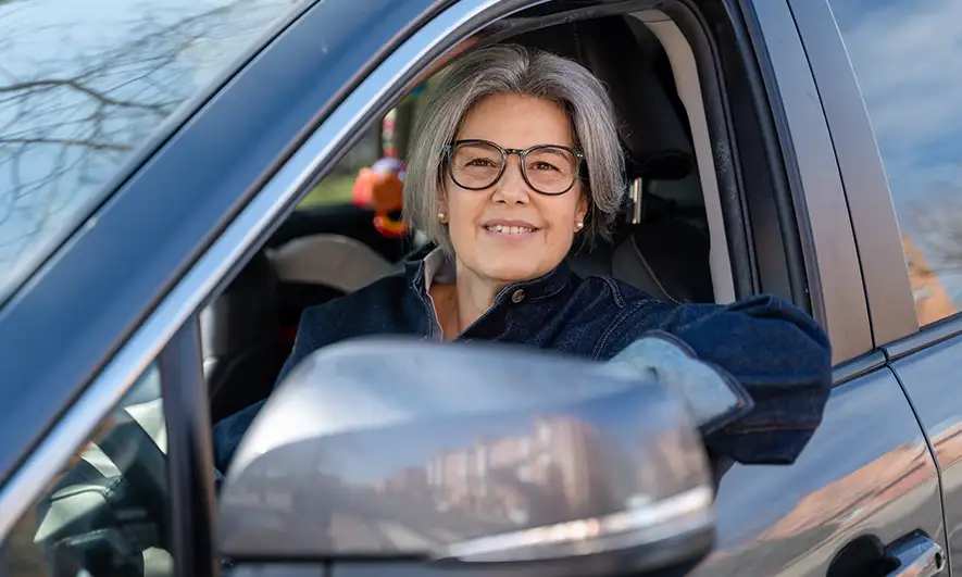 woman happy knowing how does a deductible work for auto insurance