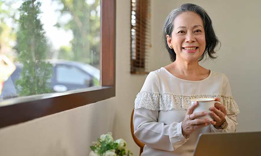 happy woman researching how much home insurance do i need