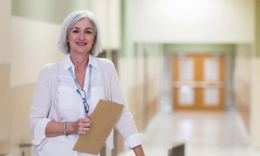 small business owner is happy after getting an insurance for administrative services quote from The Hartford