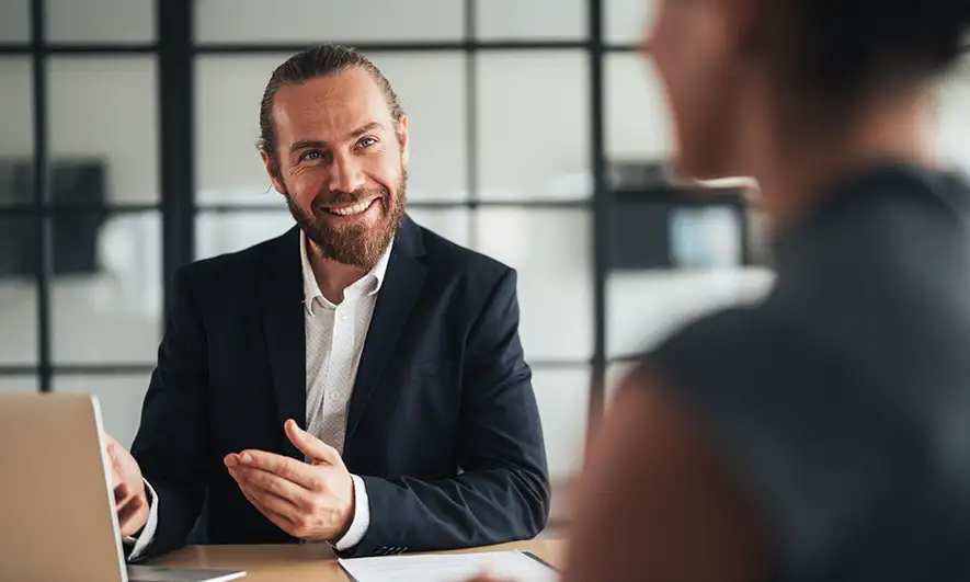 business owners happily protected by insurance for a digital marketing agency