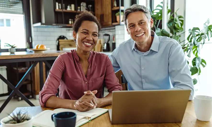 couple pleased after getting insurance for a new car