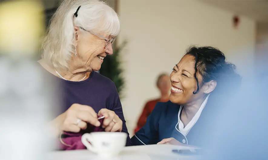 business owner happily does her job after getting insurance for assisted living facilities
