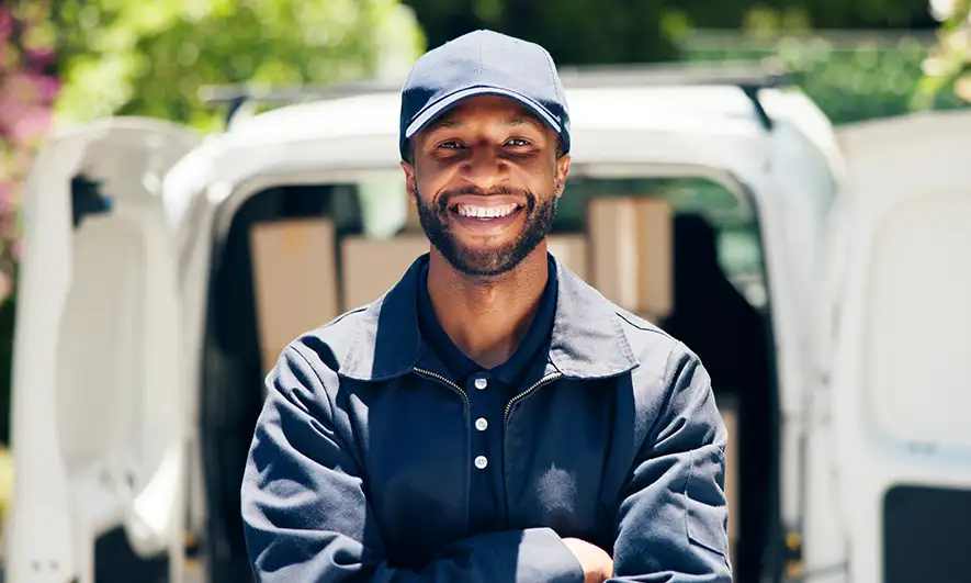 business owner happy being protected by insurance for business car