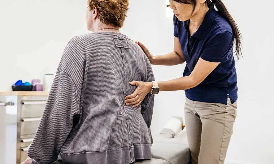 small business owner protected by insurance for chiropractor