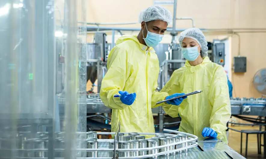 male and female small business owners protected by insurance for food manufacturers