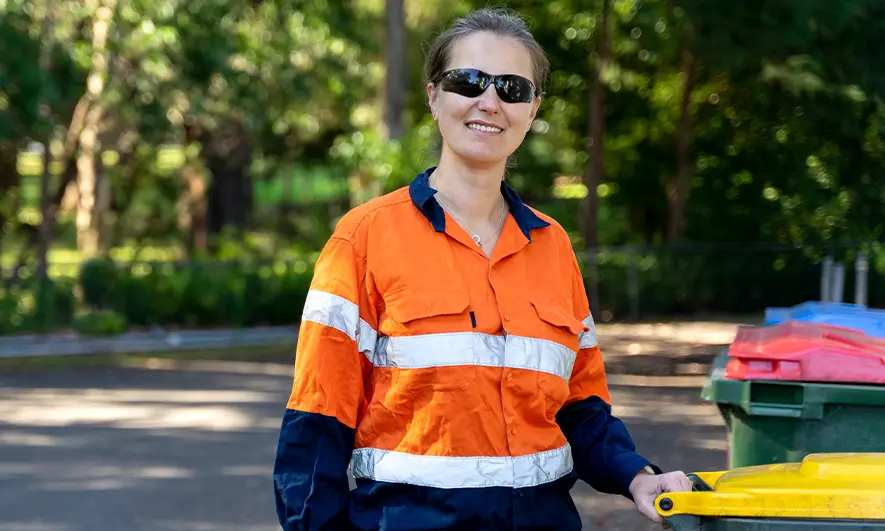 small business owner protected by insurance for garbage haulers