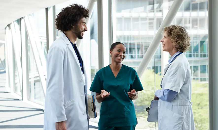 business owners happily do their jobs after getting insurance for healthcare staffing agency