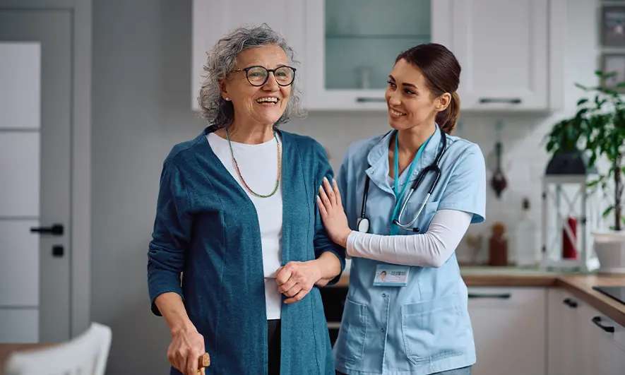 business owner happy to do her job after getting insurance for home health care