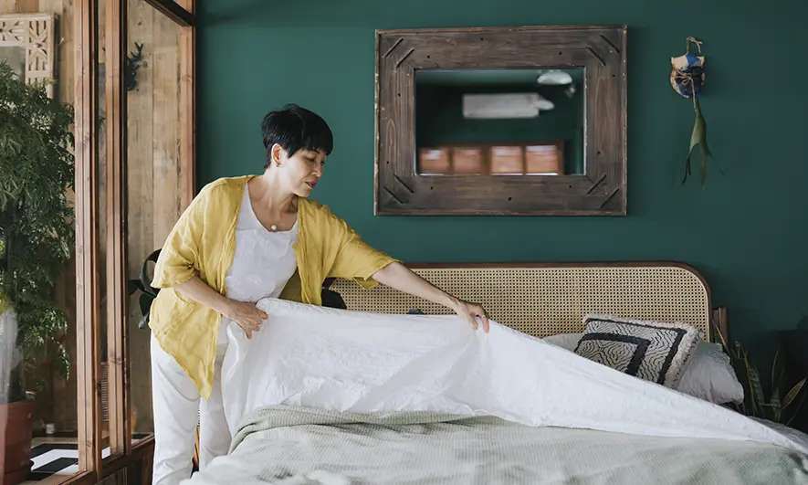 female small business owner happy to easily get insurance for home stagers