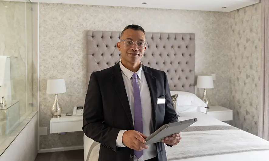 business owner happy after getting insurance for hotels