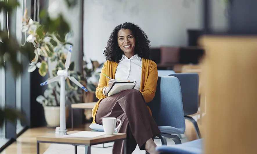 business owner happy to do her job after getting insurance for hypnotherapists