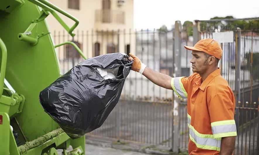 small business owner protected by insurance for junk removal business