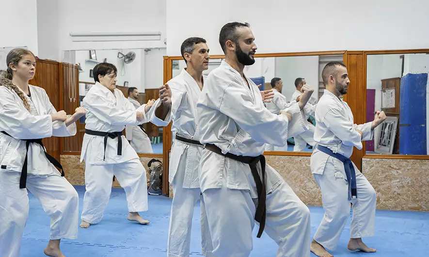 business owners happy to do their jobs after getting insurance for karate