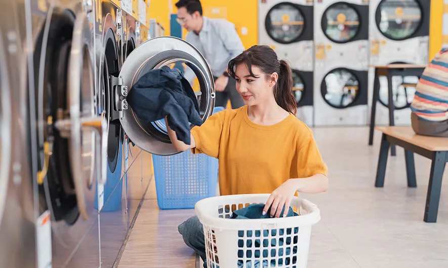 small business owner protected by insurance for laundry business