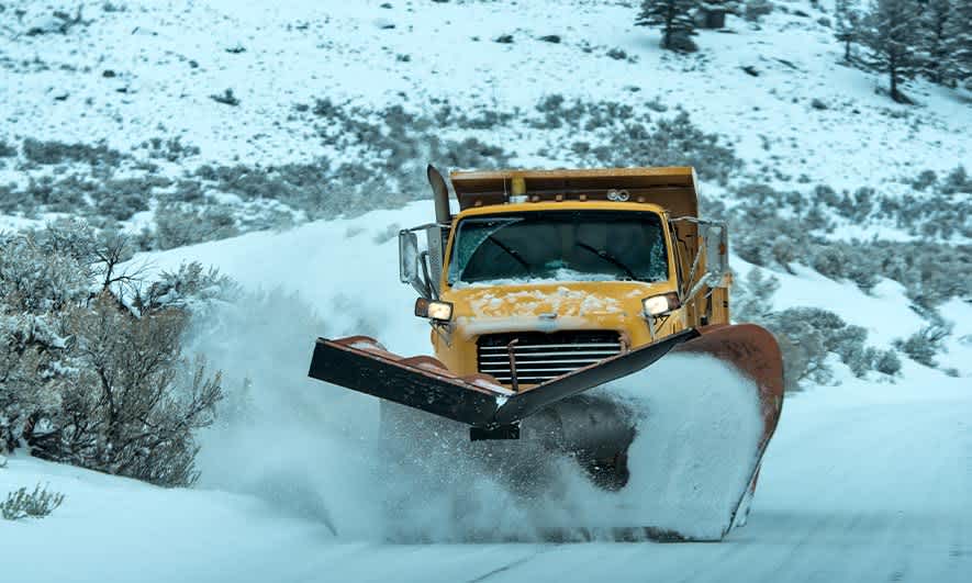 small business owner safe with insurance for snow plowing