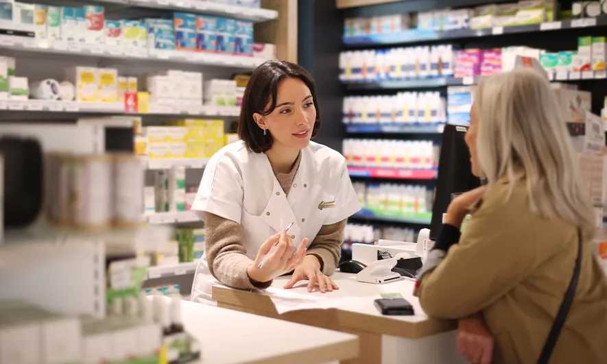 business owner happy to do her job after getting insurance for supplement company
