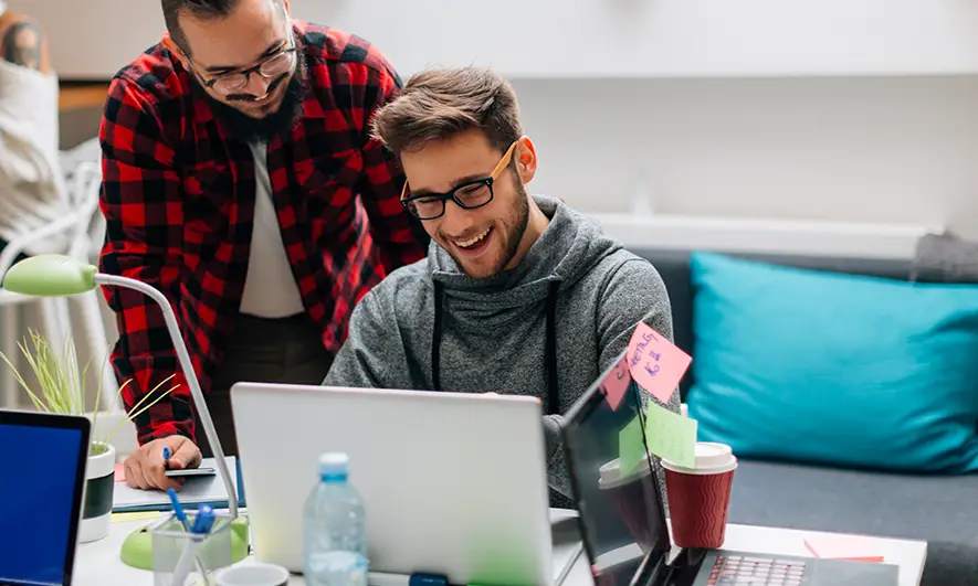 male small business owners happy to easily get insurance saas