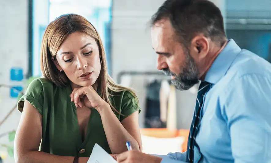 female and male small business owners protected by liability insurance from The Hartford