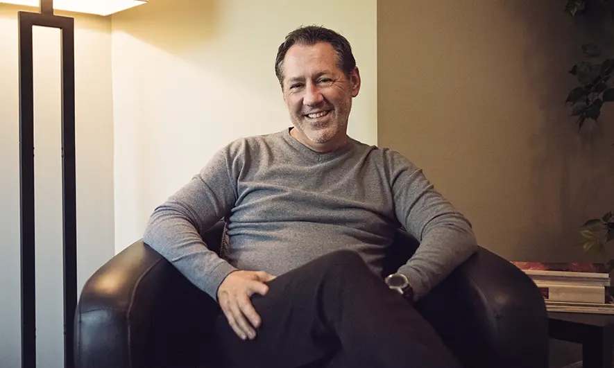 male small business owner happy with liability insurance for psychologists