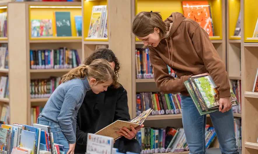 small business owner is happy after getting library insurance quote from The Hartford
