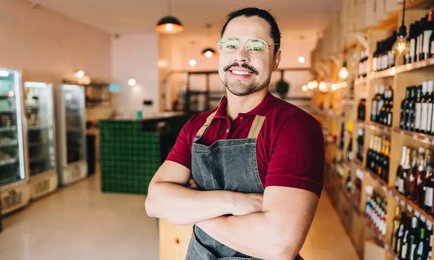 business owner happy after getting liquor store insurance quote