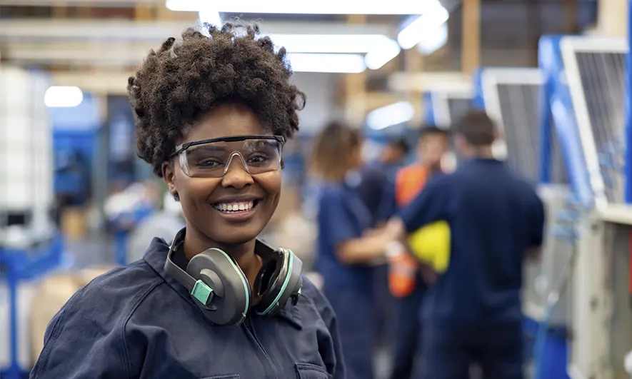 Manufacturing worker smiles