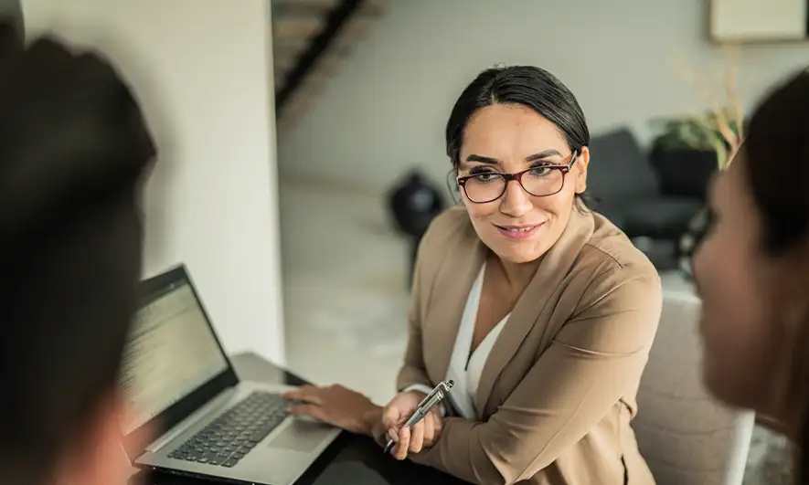 small business owner happy to do her job after getting a mortgage broker insurance quote