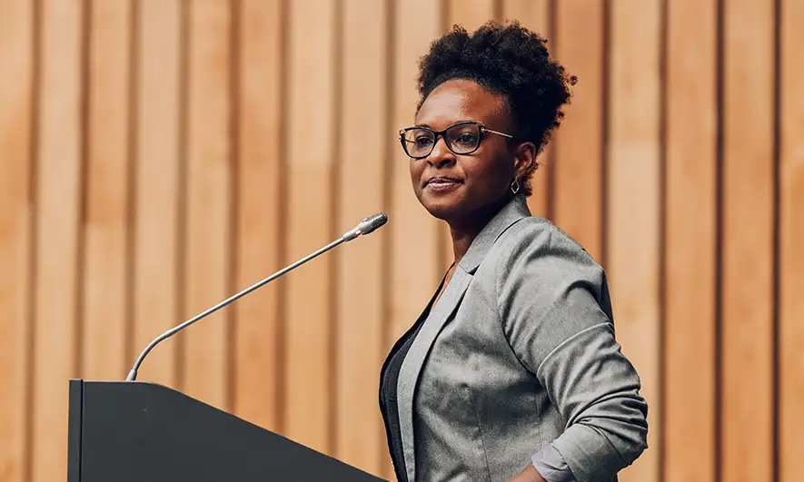 female small business owner happy to easily get insurance motivational speaker insurance