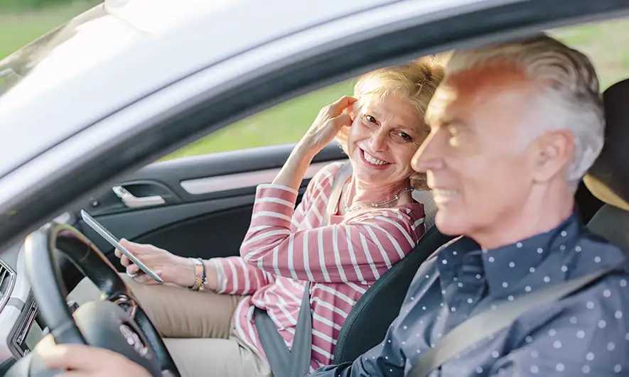 couple in car happy to know about no license auto insurance