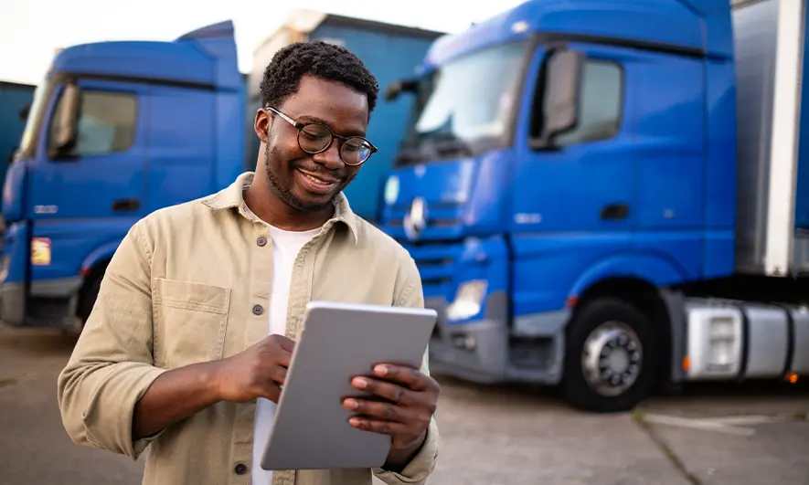 business owner happy to do his job after getting owner operator truck insurance