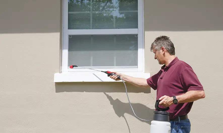 business owner happy after getting pest control business insurance quote