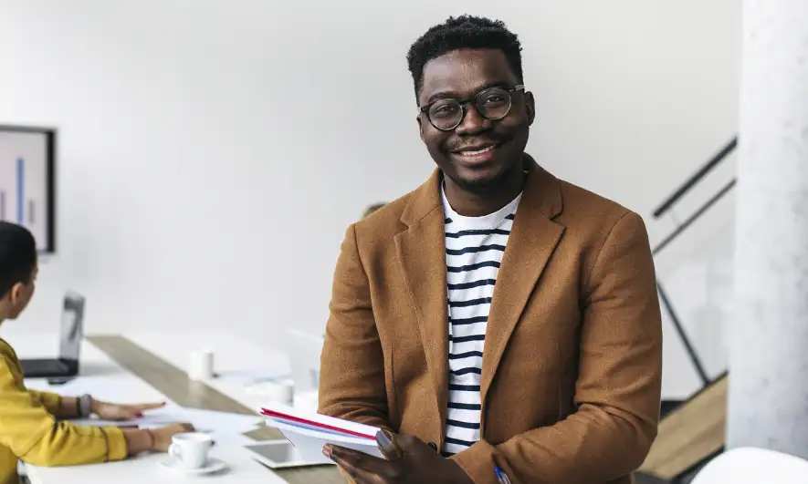 business owner happy after getting proof of insurance for education consultant