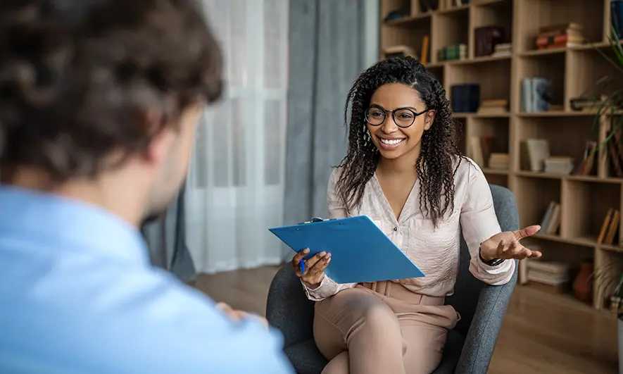 business owner happy to do her job after getting psychiatrist insurance quote