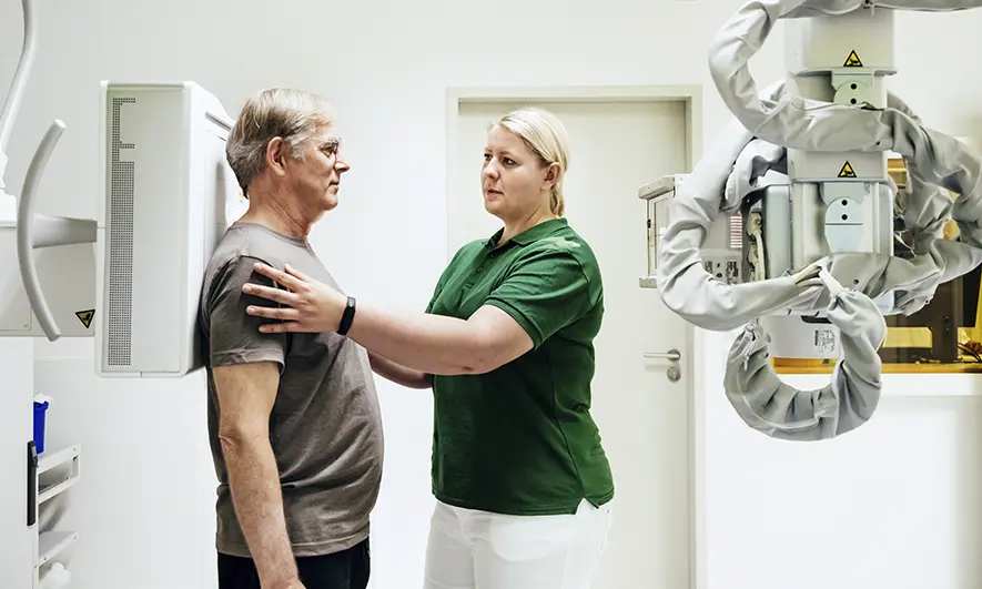 business owner happy to do their job after getting a radiologist malpractice insurance quote