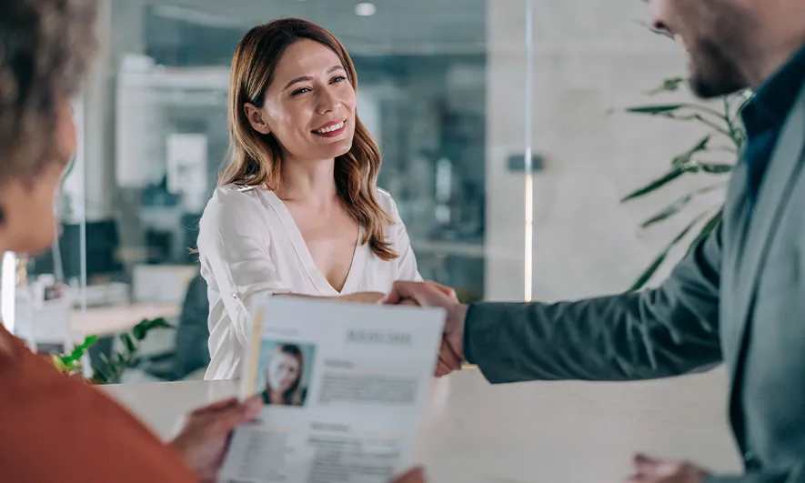 small business owner happy after getting recruiter insurance quote