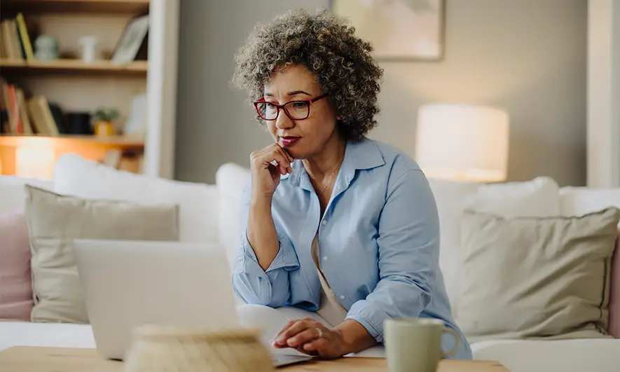 woman researching rental car reimbursement insurance