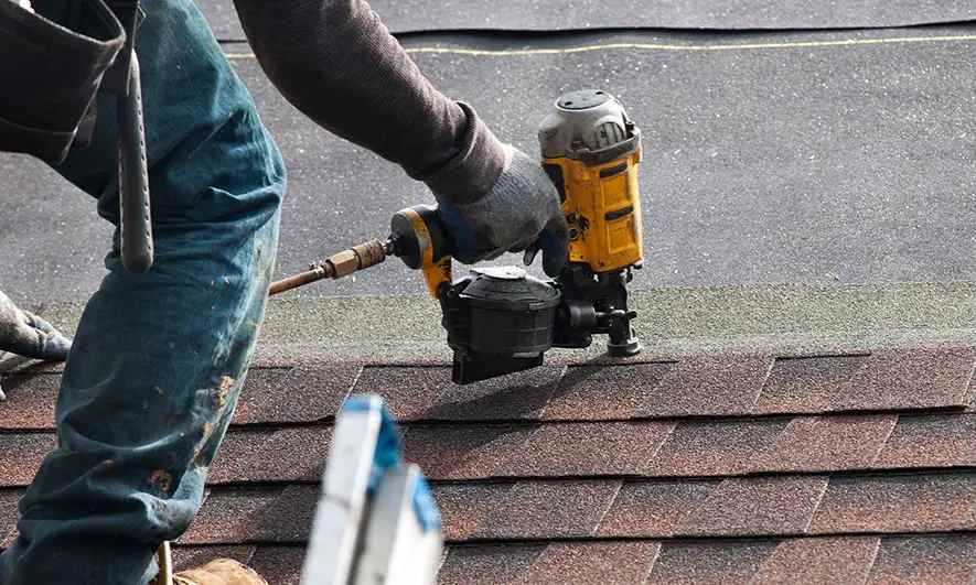 male small business worker protected by roofers insurance
