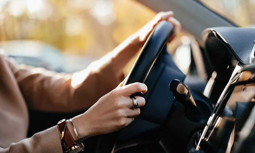 driver happy with safe driver auto insurance discounts from The Hartford