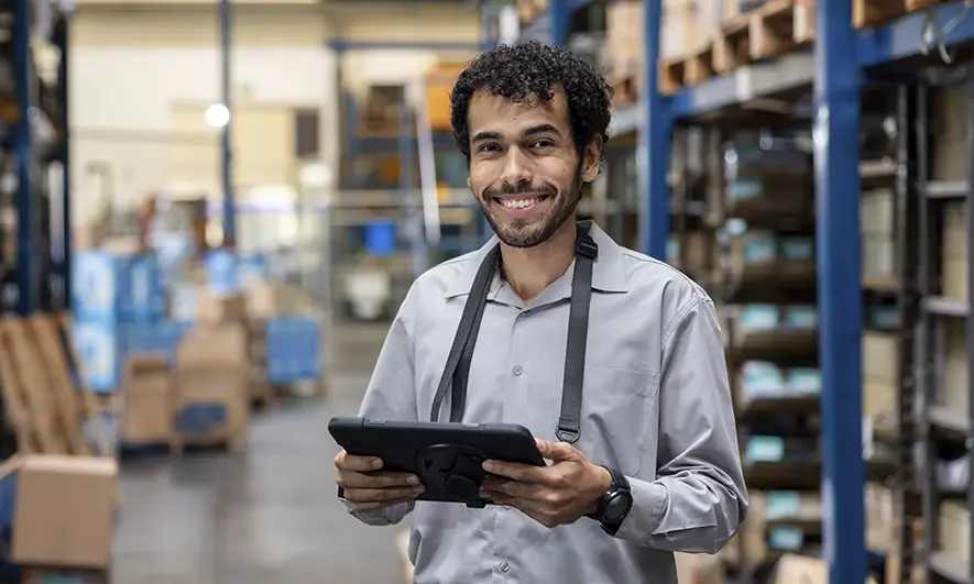 male business owner happily works after getting safety consultant insurance quote